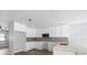 Updated kitchen featuring white cabinets, stainless appliances, and tile backsplash at 116 Hermes Rd, Venice, FL 34293