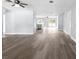Bright and spacious living room with modern flooring, neutral paint, and an open floor plan concept at 116 Hermes Rd, Venice, FL 34293