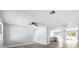 Open-concept living area featuring modern flooring, neutral paint, and a seamless transition to the kitchen at 116 Hermes Rd, Venice, FL 34293