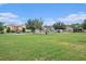 An expansive green common lawn area with mature trees and well-maintained landscaping at 12117 Streambed Dr, Riverview, FL 33579