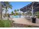 Resort-style community pool with lounge chairs and shade at 12117 Streambed Dr, Riverview, FL 33579