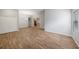 Open living room with wood tile floors and lots of natural light at 12117 Streambed Dr, Riverview, FL 33579