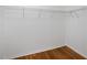 Walk-in closet with wire rack shelving and hardwood floors at 12117 Streambed Dr, Riverview, FL 33579