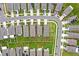 Areal view of a well-maintained neighborhood with lush green lawns and neatly arranged homes at 17071 Oval Rum Dr, Wimauma, FL 33598