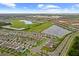 Serene neighborhood with community amenities, surrounded by scenic lakes and lush greenery at 17071 Oval Rum Dr, Wimauma, FL 33598