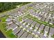 Overhead view of neighborhood showing the layout with sidewalks and green spaces at 17071 Oval Rum Dr, Wimauma, FL 33598