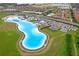 Resort-style community pool with lazy river, beach, and lounge area at 17071 Oval Rum Dr, Wimauma, FL 33598