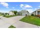 Charming single-Gathering home featuring a well-maintained lawn, driveway, and one-car garage at 17071 Oval Rum Dr, Wimauma, FL 33598