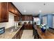 Updated kitchen features stainless steel appliances and granite countertops at 17071 Oval Rum Dr, Wimauma, FL 33598