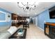 Spacious living room open to the kitchen with modern appliances and stylish furnishings at 17071 Oval Rum Dr, Wimauma, FL 33598