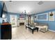Comfortable living room featuring stylish décor, fireplace, and abundant natural light at 17071 Oval Rum Dr, Wimauma, FL 33598