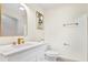 Bright bathroom featuring marble countertops, modern fixtures, and sleek, contemporary design at 203 Driftwood W Dr, Palm Harbor, FL 34683