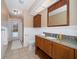 Updated bathroom with granite counters and direct access to outdoor area, offering modern convenience at 2567 Frisco Dr, Clearwater, FL 33761