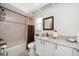 Bright bathroom featuring tile flooring, a bathtub, a shower, and vanity sink at 2567 Frisco Dr, Clearwater, FL 33761