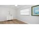 Bright bedroom with wood-look floors and ample natural light, creating a serene atmosphere at 2567 Frisco Dr, Clearwater, FL 33761