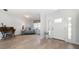 Inviting entryway with wood-look floors, a side window, and ample natural light at 2567 Frisco Dr, Clearwater, FL 33761