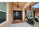 Welcoming front porch with stylish front door, seating and 'Welcome Home' mat at 2567 Frisco Dr, Clearwater, FL 33761