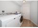 Functional laundry room with modern washer and dryer, offering convenience and efficiency at 2567 Frisco Dr, Clearwater, FL 33761