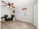 Bright living room with wood-look floors, complemented by a comfortable recliner and modern decor at 2567 Frisco Dr, Clearwater, FL 33761