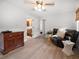 Cozy living room with wood floors and a glimpse of the bathroom, creating a warm and inviting space at 2567 Frisco Dr, Clearwater, FL 33761