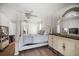 Bright primary bedroom featuring a bed, vanity, and luxury furnishings at 2567 Frisco Dr, Clearwater, FL 33761