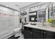Modern bathroom featuring stylish tiling, updated vanity with black cabinets, and a walk-in shower at 2591 Countryside Blvd # 5304, Clearwater, FL 33761
