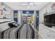 The bedroom is modern with sliding glass door to the patio and a flat screen TV at 2591 Countryside Blvd # 5304, Clearwater, FL 33761