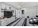 Comfortable bedroom with black and white theme, featuring a closet, and a stylish dresser at 2591 Countryside Blvd # 5304, Clearwater, FL 33761