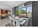 Bright dining area featuring a modern table and chairs, with large windows at 2591 Countryside Blvd # 5304, Clearwater, FL 33761