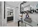 Hallway leading to a modern bathroom with sleek fixtures and stylish decor at 2591 Countryside Blvd # 5304, Clearwater, FL 33761