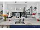 Open kitchen with granite counters, stainless steel sink, pendant lighting, and view to living area beyond at 2591 Countryside Blvd # 5304, Clearwater, FL 33761