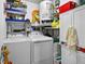 Functional laundry room with washer, dryer, and storage, providing convenience for chores at 2591 Countryside Blvd # 5304, Clearwater, FL 33761