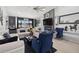 Bright living room features stylish furniture, a modern fireplace, and a ceiling fan at 2591 Countryside Blvd # 5304, Clearwater, FL 33761