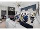 The living room is modern with stylish seating, stone fireplace, and open layout to the kitchen at 2591 Countryside Blvd # 5304, Clearwater, FL 33761