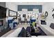 Living room with stylish decor that flows into the modern kitchen and dining area at 2591 Countryside Blvd # 5304, Clearwater, FL 33761