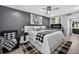 Stylish main bedroom with gray walls, modern decor, and a plush bed, offering a comfortable retreat at 2591 Countryside Blvd # 5304, Clearwater, FL 33761