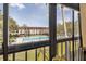 Screened-in porch view showcasing the community pool and lush landscaping; perfect for relaxation and enjoying the outdoors at 2591 Countryside Blvd # 5304, Clearwater, FL 33761