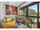 Bright sunroom with stylish decor, comfortable seating, and a view of the outdoors, perfect for relaxation at 2591 Countryside Blvd # 5304, Clearwater, FL 33761