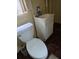 Simple bathroom featuring a toilet and a small sink, ideal for basic needs at 2612 E 17Th Ave, Tampa, FL 33605