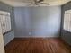Bedroom with hardwood floors, freshly painted walls, and light-filtering window coverings at 2612 E 17Th Ave, Tampa, FL 33605