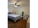 Comfortable bedroom with hardwood floors, ceiling fan, and lots of natural light at 2612 E 17Th Ave, Tampa, FL 33605