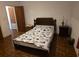 Cozy bedroom with a comfortable bed and wooden bedside tables, creating a relaxing space at 2612 E 17Th Ave, Tampa, FL 33605