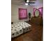 Bedroom with hardwood floors, dresser, and natural light at 2612 E 17Th Ave, Tampa, FL 33605