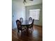 Dining room with hardwood floors, a classic table, and a view of the backyard at 2612 E 17Th Ave, Tampa, FL 33605