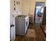 Kitchen with white cabinets, a gas range stove, and tiled backsplash at 2612 E 17Th Ave, Tampa, FL 33605