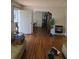 Inviting living room featuring hardwood floors, neutral walls, and an open layout at 2612 E 17Th Ave, Tampa, FL 33605
