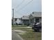 Neighborhood street featuring well maintained houses, parked cars and sidewalks at 2612 E 17Th Ave, Tampa, FL 33605