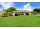 Beautiful lush backyard with a green lawn and well-maintained landscaping at 3568 Wilkinson Woods Dr # 23, Sarasota, FL 34231