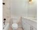 Modern bathroom features a white vanity with drawers, marble countertops, and a shower-tub combo at 3568 Wilkinson Woods Dr # 23, Sarasota, FL 34231