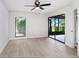 Light and airy bedroom with natural light, wood-look floors and a sliding glass door at 3568 Wilkinson Woods Dr # 23, Sarasota, FL 34231